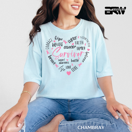 Woman wearing a light blue t-shirt with breast cancer awareness text and graphics.