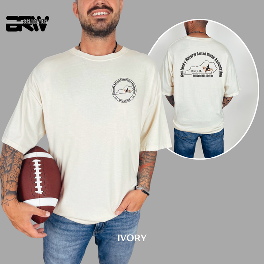 Man wearing a white t-shirt with a logo, holding a football, and an inset showing the back of the shirt. KNGHA KENTUCKY NATURAL GAITED HORSE ASSOCIATION T SHIRT